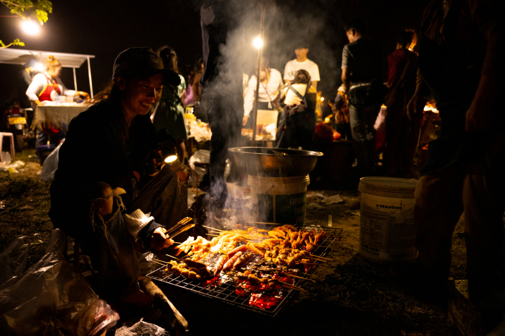 Hakbong Kwon, SEA: Day and Night, Woman Working in a Makeshift Kitchen Behind the Festival, 2024, Muang Sing, Laos